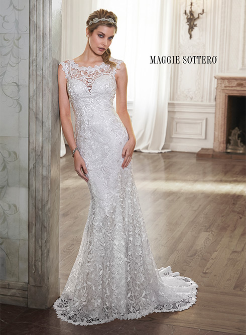 Ellis: This lace sheath wedding dress balances elegant details of a scalloped hemline with dramatic touches, such as an illusion plunging sweetheart neckline.