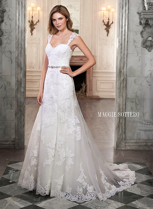 Marty: This A-line wedding dress is complete with floral lace appliqués drifting down a tulle skirt and romantic sweetheart neckline.